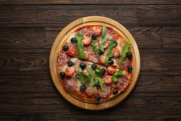 Stages of making pizza. Salami pizza