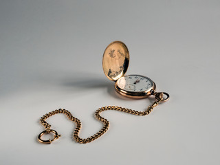 old pocket gold watch on the table