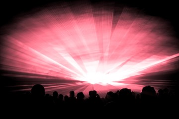 Red laser show nightlife club stage with party people crowd. Luxury entertainment with audience silhouettes in nightclub event, festival or New Years Eve. Beams and rays shining colorful lights