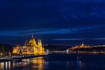 Fototapeta na wymiar Budapest during the night, Hungarian parliament (left) and Buda castle (right)