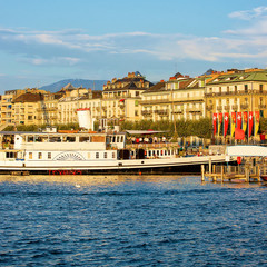 Fototapeta na wymiar Steamboat in Geneva Lake at Promenade du Lac in summer, Geneva, Switzerland. People on the background