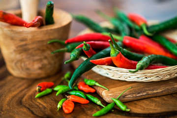 red chili peppers on wooden board