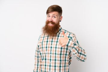 Obraz premium Redhead man with long beard over isolated white background giving a thumbs up gesture