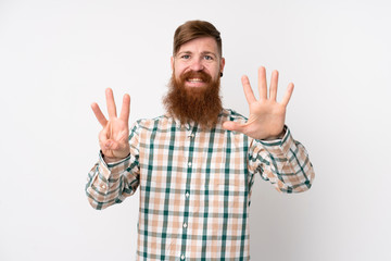 Naklejka premium Redhead man with long beard over isolated white background counting eight with fingers