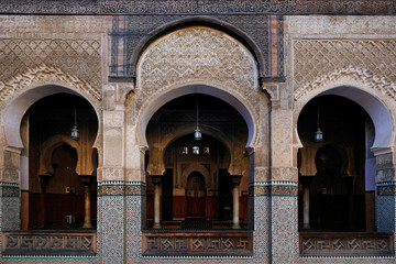 Colorful ornamental tiles at moroccan courtyard, close-up view of mosaic wall in a mosque