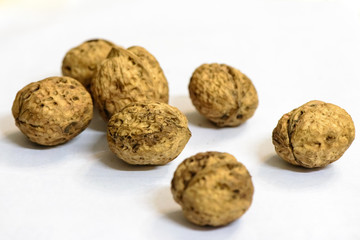 Some walnuts are isolated on white background.