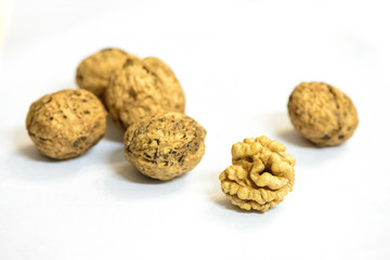 Some walnuts are isolated on white background.