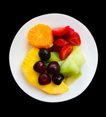 plate of healthy fruit, pineapple, water melon, strawberries, orange and cherries