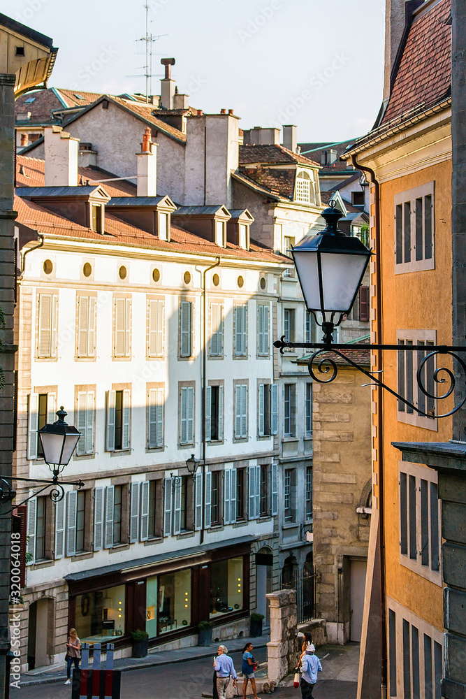 Poster geneva, switzerland - august 30, 2016: people in the street at geneva old city center, switzerland