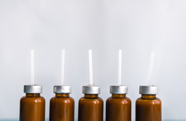 Probiotic liquid bifidobacteria in a white bubble on a blue background. Concept of medicine. Prevention.