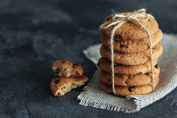 Oat cookies on a dark background. Background image, copy space