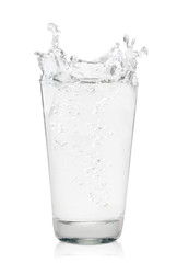 Glass of water with splash on a white background. Isolated