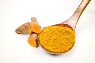Turmeric powder (turmeric) and turmeric roots isolated on a white background are used as ingredients in turmeric foods. Turmeric helps to strengthen the skin.