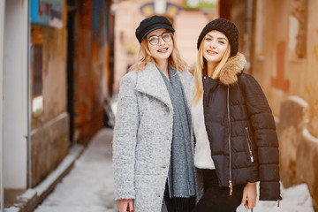 Fashion girl in a winter city. Girl in a glasses;