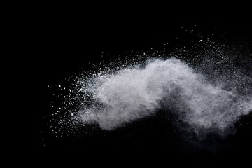 White powder explosion on black background. 