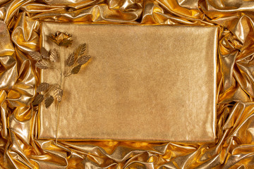 Background from a golden fabric with random drapery