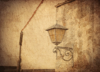 aged street lighting lamp in Germany. Image in old color style