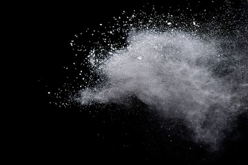 White powder explosion on black background. 