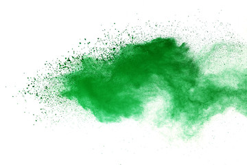 Green powder explosion on white background.