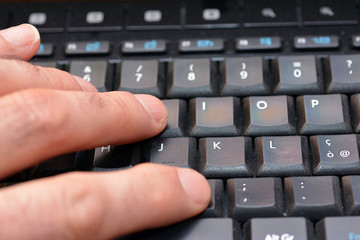Close-up view hands of man working on the computer