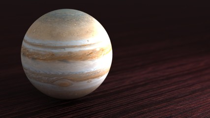 Planet of the solar system Jupiter. Little planet lies on the table. 3D illustration.