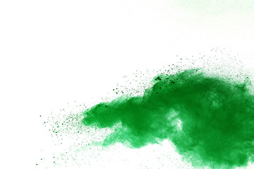 Green powder explosion on white background.