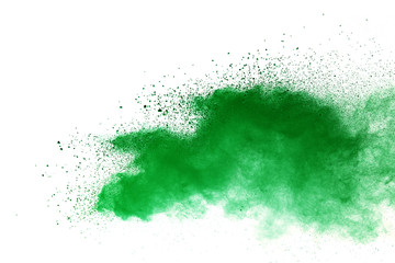 Green powder explosion on white background.