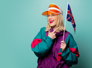 Style blonde woman in 90s sport suit with Great Britain flag