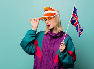 Style blonde woman in 90s sport suit with Great Britain flag