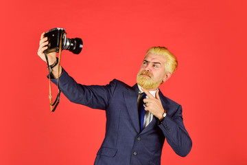 Used goods store. Man cheerful bearded hipster photographer. Photographer eccentric guy with slr camera. Classy and old school. Photographer with beard mustache. Vintage style trend. Content creator