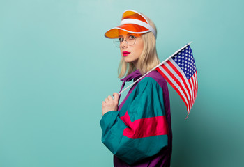 Beautiful woman in 90s sport suit in glasses with USA flag