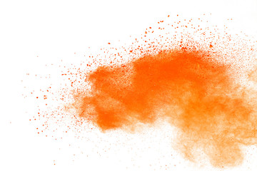 Fototapeta na wymiar Abstract orange powder explosion. Closeup of orange dust particle splash isolated on white background.