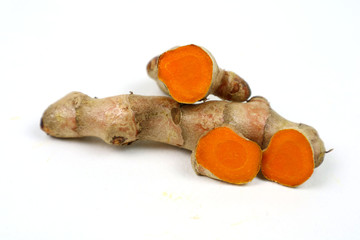 Turmeric root (curcuma) Turmeric extracted on a white background is used as an ingredient in...