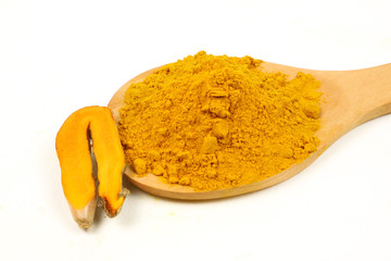 Turmeric powder (turmeric) and turmeric roots isolated on a white background are used as...