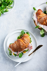 Fresh croissant with green salad