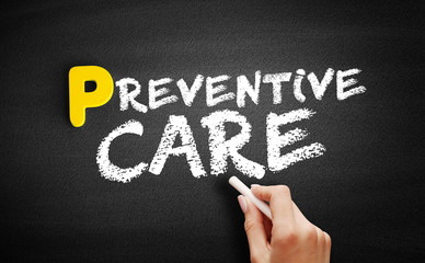 Preventive care text on blackboard, concept background