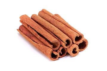 Stack of cinnamon sticks, isolated on white background.