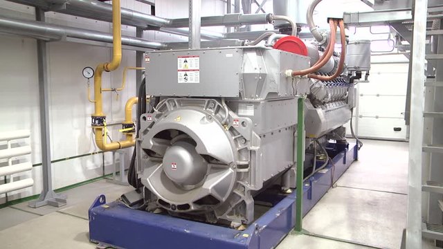 Large emergency diesel generator for a data center. A very large electric diesel generator in factory for emergency, equipment plant modern technology industrial 