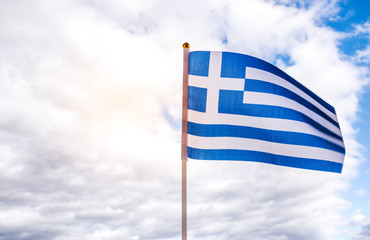 Flag of Greece and cloudy sky background