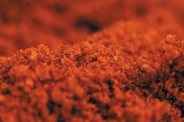 Red chilli powder macro background image close-up