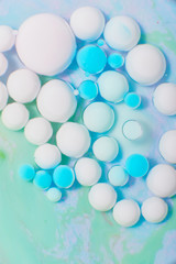 Ink Bubbles In Water. Colorful ink reacting in water creating abstract background.