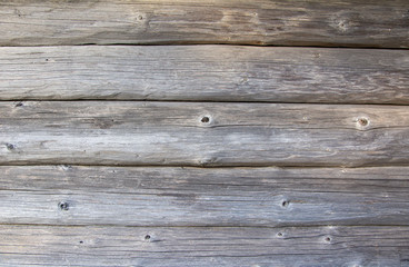 Obraz premium Wall of a wooden log house wall with natural textures