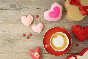Valentines day background with heart shapes, coffee cup and  gift boxes.