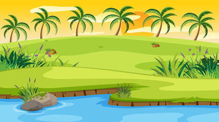 Nature scene with river and field at sunset