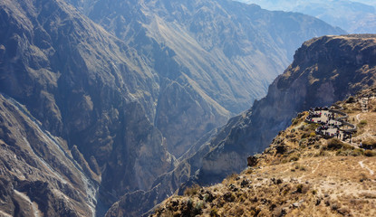 tourists at 'Cruz del Condor' viewpoint, on the valley of 'Canyon del Colca', in Arequipa/Peru.