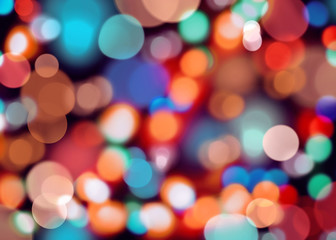 Abstract background with evening lights Defocused colorful light spots with on black backdrop