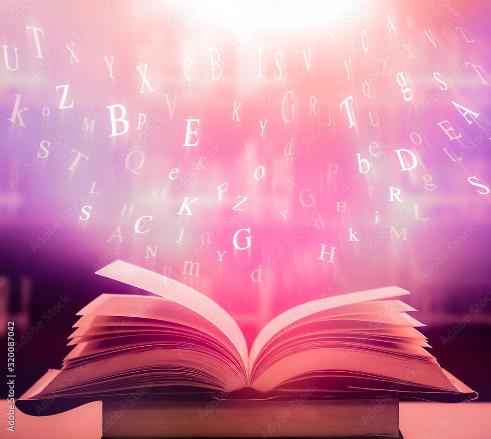 Poster open book on the table and english alphabet floating above the book in the library and blur bookshel