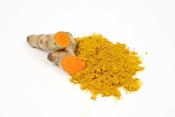 Turmeric powder (turmeric) and turmeric roots isolated on a white background are used as...