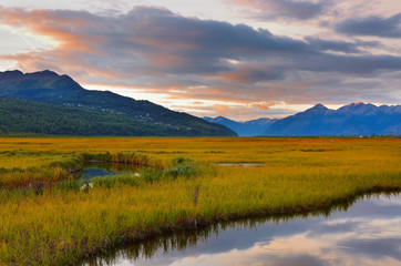 Fototapeta na wymiar Beautiful sunrise at Potter Marsh Wildlife Viewing Boardwalk, Anchorage, Alaska. Potter Marsh is located at the southern end of the Anchorage Coastal Wildlife Refuge.