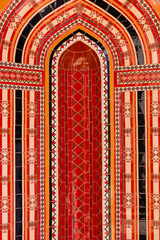 Red mosaic ornament decoration background, Eastern ethnic oriental texture. Muscat, Oman. Sultan Qaboos Grand Mosque